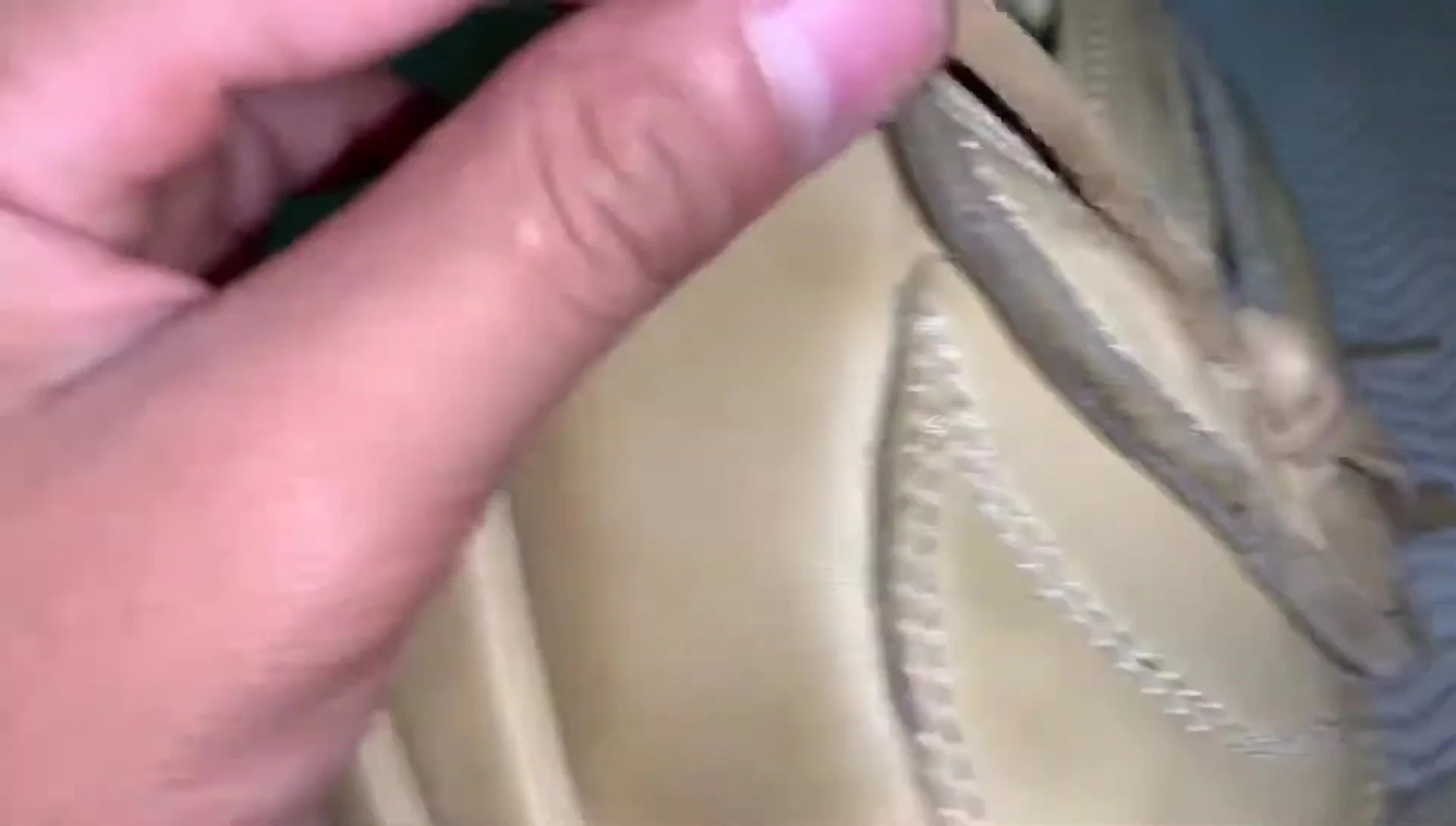 Close-up of Rawlings glove lacing, showing thickness and softness