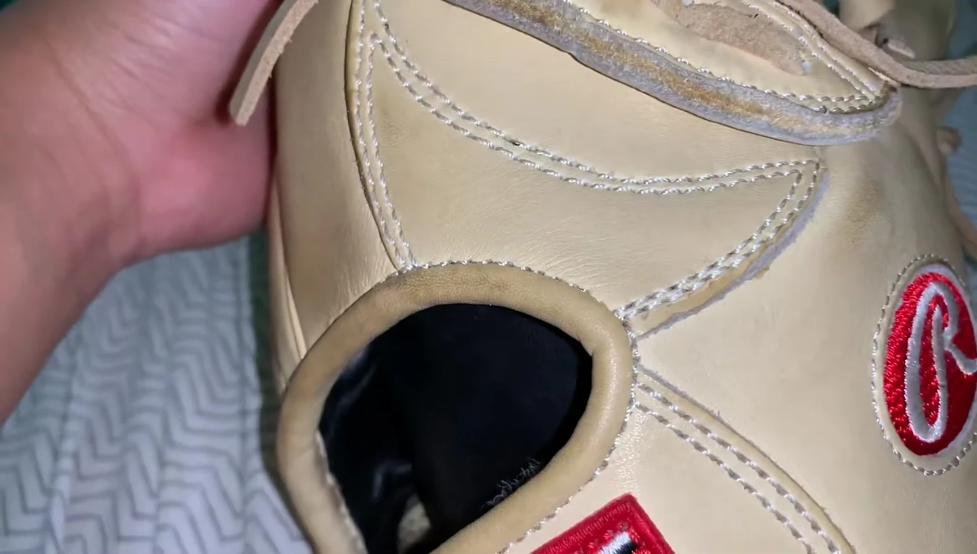 Close-up showing the stitching on a Wilson glove