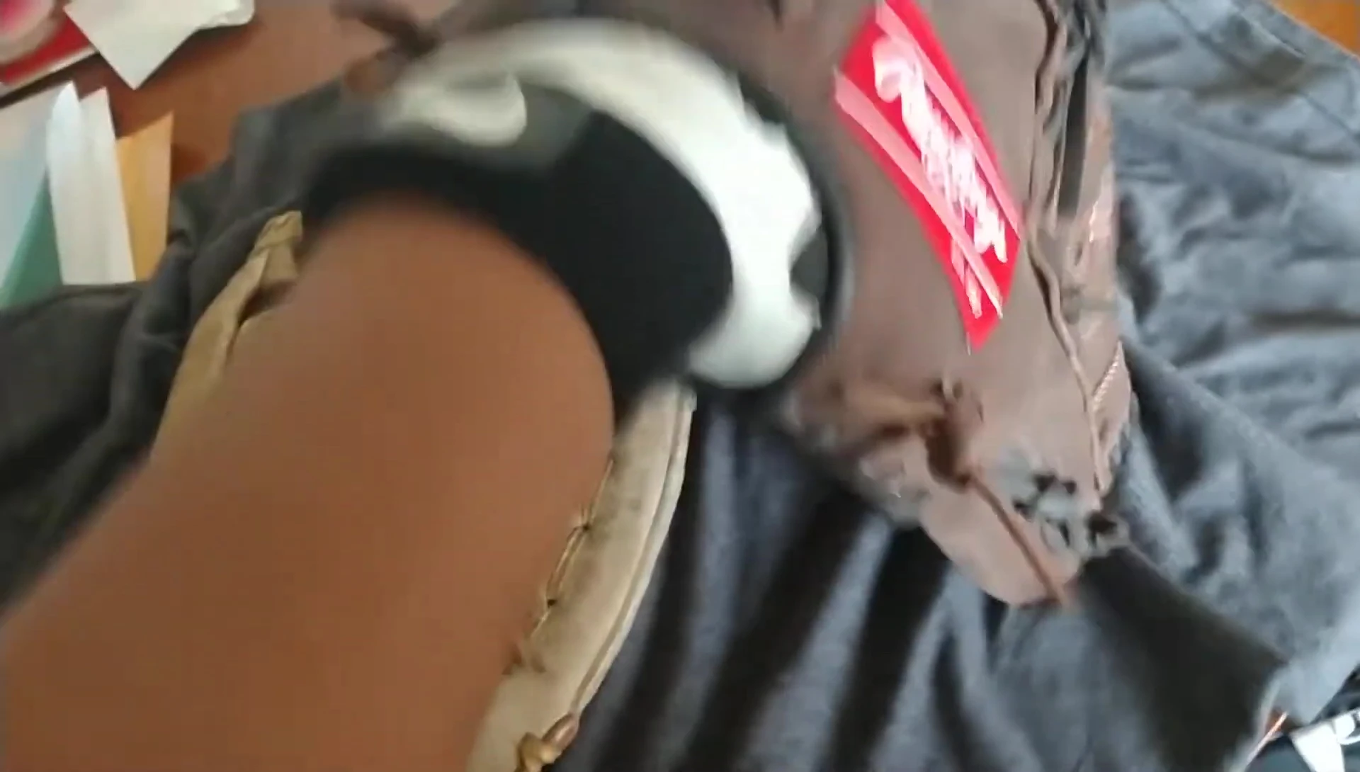 The speaker demonstrating how he checks the glove fit using a batting glove