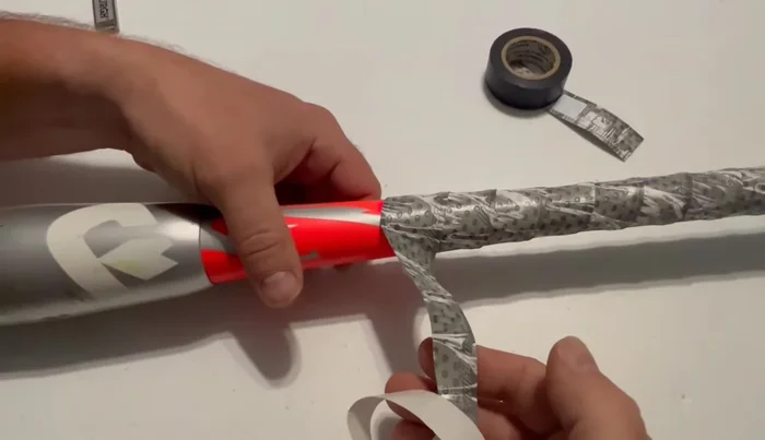 Secure the end of the grip by wrapping it tightly to ensure it is straight.