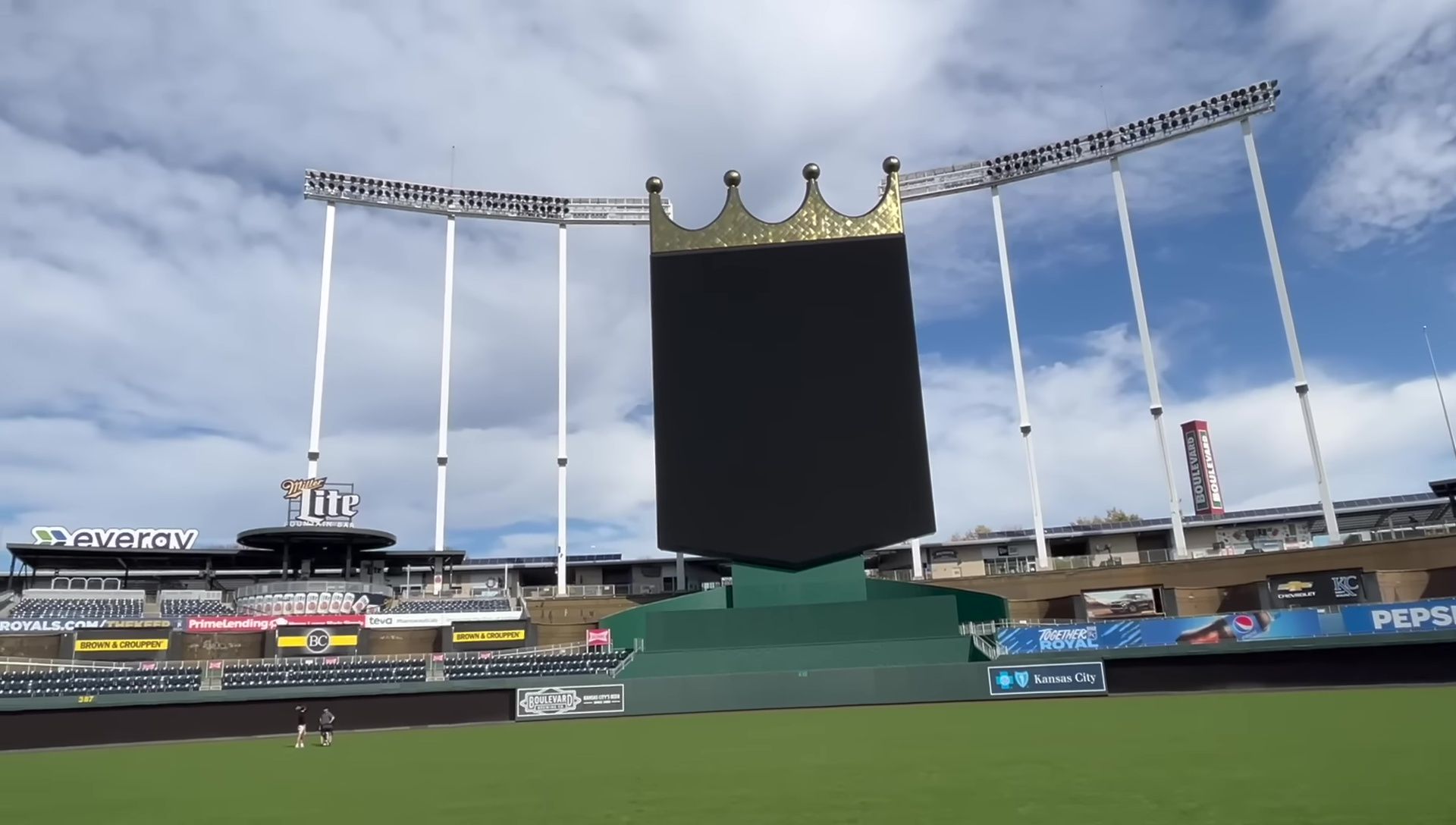 Bats being swung on a baseball field