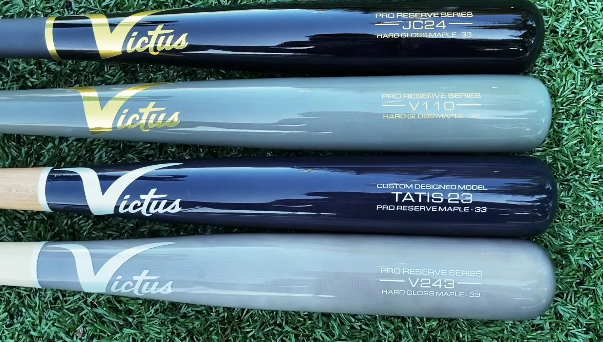 Close-up view of four Victus maple bats arranged from top to bottom.