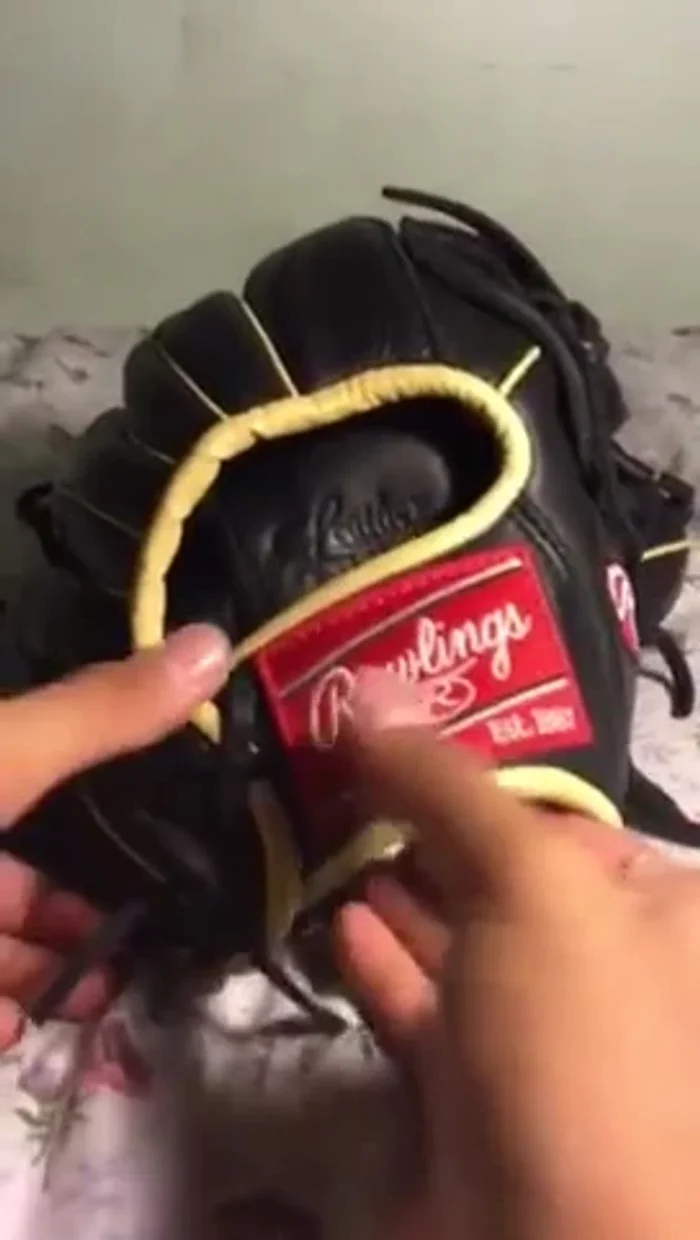 Once the 'X' pattern is complete, tighten the laces and tie them off.