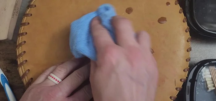 Wipe the glove with a clean rag to remove any remaining dirt and cleaner.