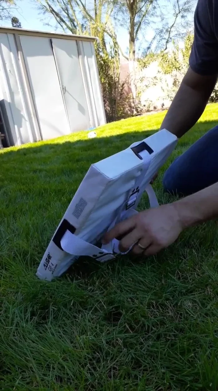 Drive the anchors down until they are flush with the ground. Tighten the straps.