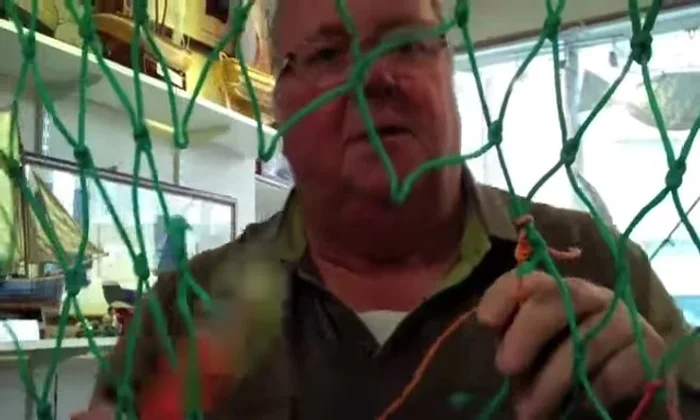 Continue picking up meshes to the right, securing each one with a hitch around the back.