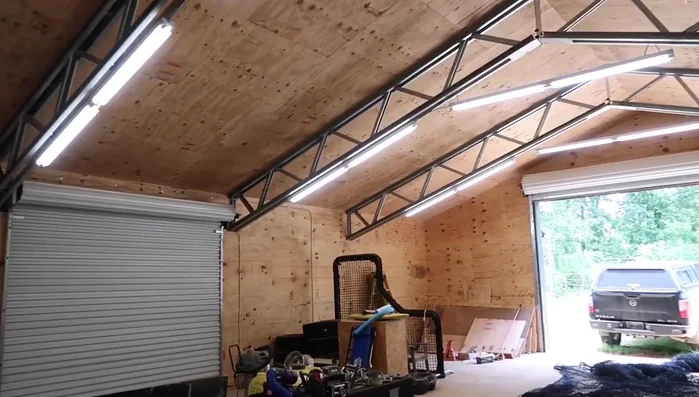 Run a main cable across the barn, securing it to the eye bolts.