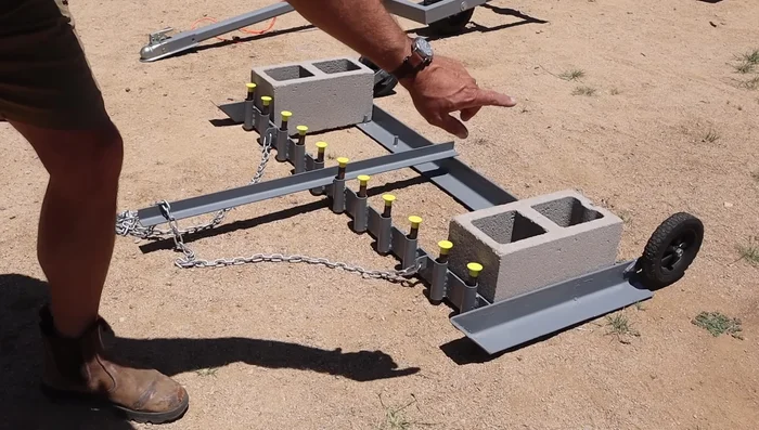 Attach a handle to the main drag to aid in lifting and moving it around obstacles.