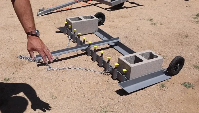 Attach a handle to the main drag to aid in lifting and moving it around obstacles.