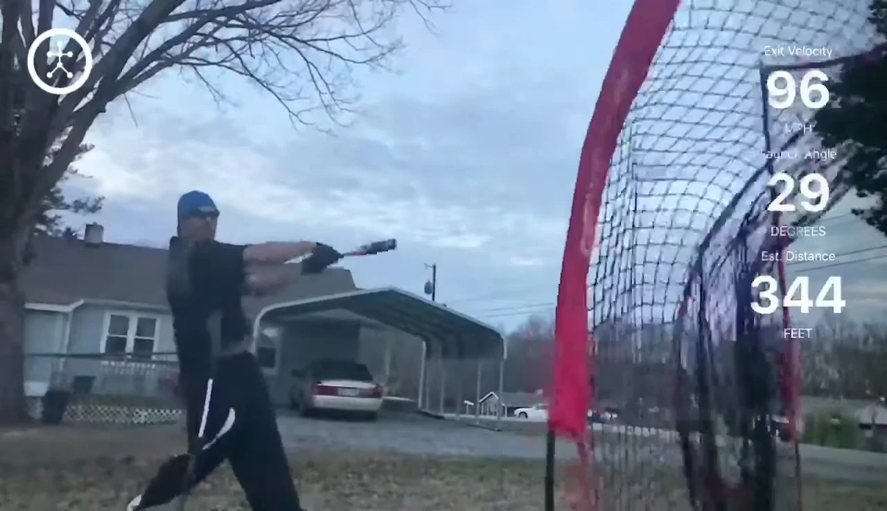 The ball hitting the top of the net and bouncing back