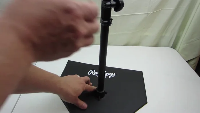 Show the collapsible feature of the tee for easy storage and transport.