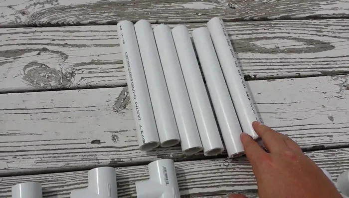 Fill the base pipes with sand for added stability (optional).