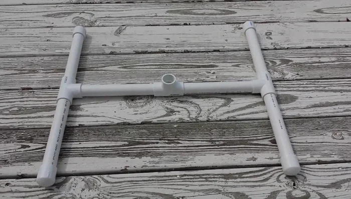 Fill the base pipes with sand for added stability (optional).