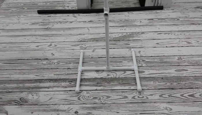 Attach the cross-connector to the central post for height adjustment.