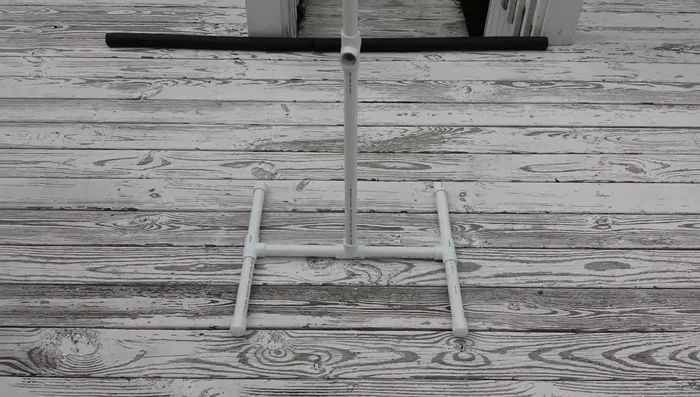 Attach the cross-connector to the central post for height adjustment.