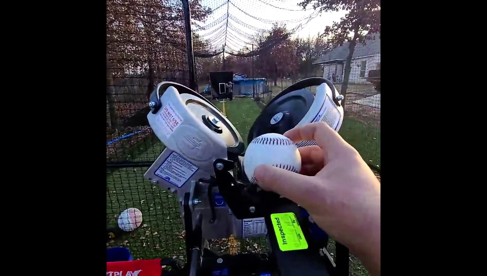 The pitching machine setup at a distance.