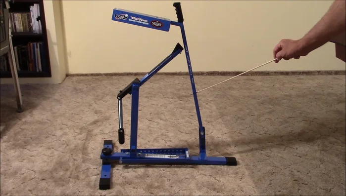 Remove the bolt from the release arm, pass it through the base holder, align the release arm with the holes, and tighten the nut.