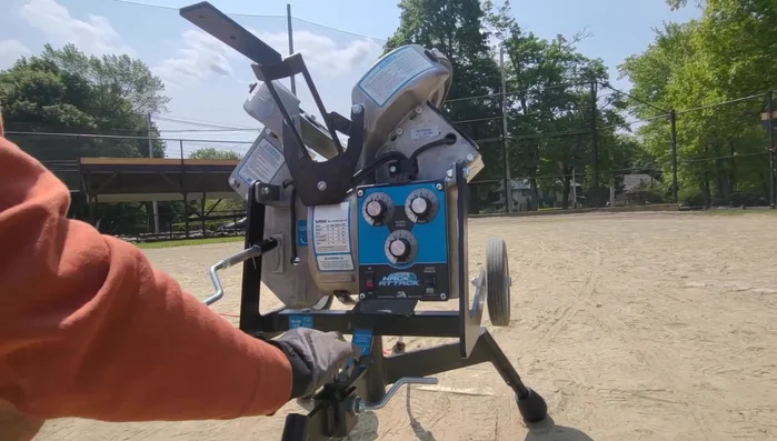 Feed softballs into the feeder, making adjustments until satisfied with the location.
