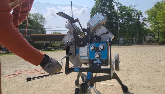 Feed softballs into the feeder, making adjustments until satisfied with the location.