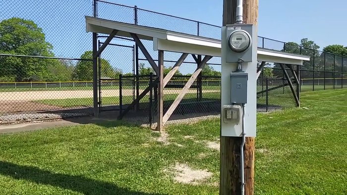 Attach the long handle attachment to the top socket and roll the machine to the desired location.