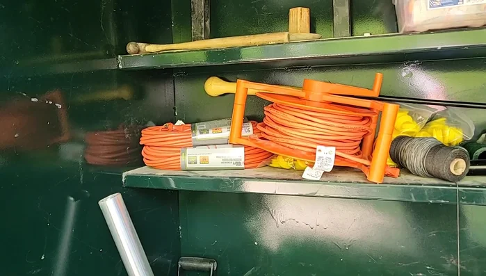 Attach the long handle attachment to the top socket and roll the machine to the desired location.