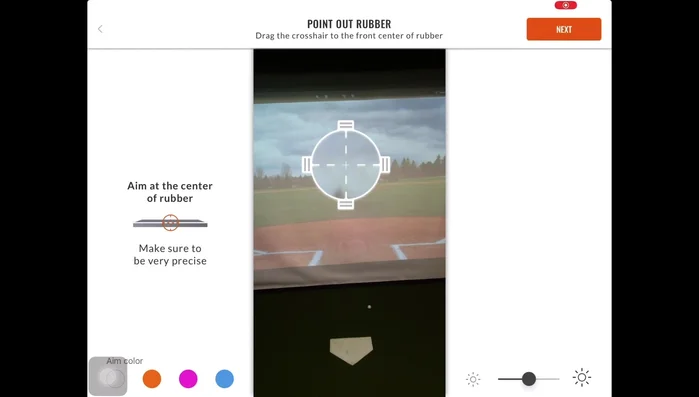 Point out the rubber. Place an object (baseball, marker) on the middle of the rubber. Use the crosshairs to pinpoint the bottom of the object. Use fine adjust if needed.