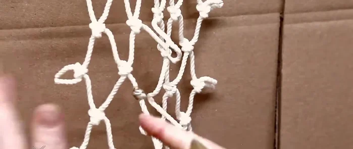 Replace the removed section: Begin from the left and sew from left to right, consistently picking up the back-side mash of the netting. This creates a seamless look consistent with the factory stitching.