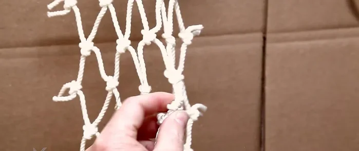 Secure the final knot: Burn the ends of the twine to secure the final knot.