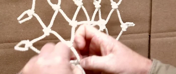 Prepare the damaged area: Loosen and untie the knots on both sides of the hole to gain enough string length for tying.