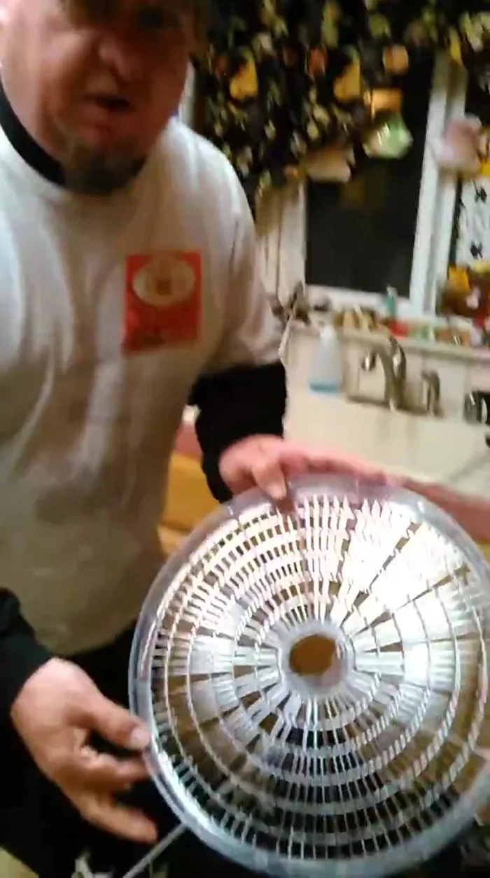 Run the hats through a rinse cycle in the dishwasher (use a tray to hold them in place if needed).