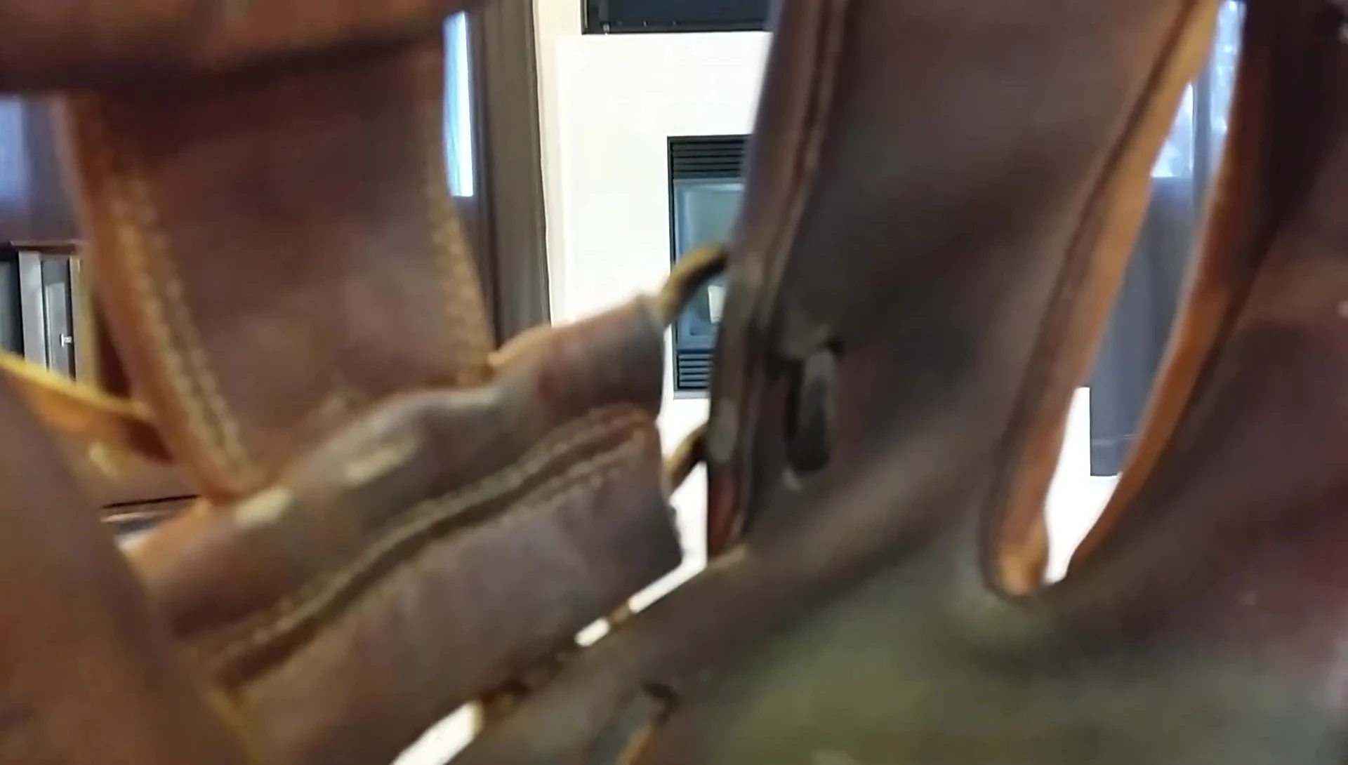 Close-up showing minor scuff marks on the glove leather