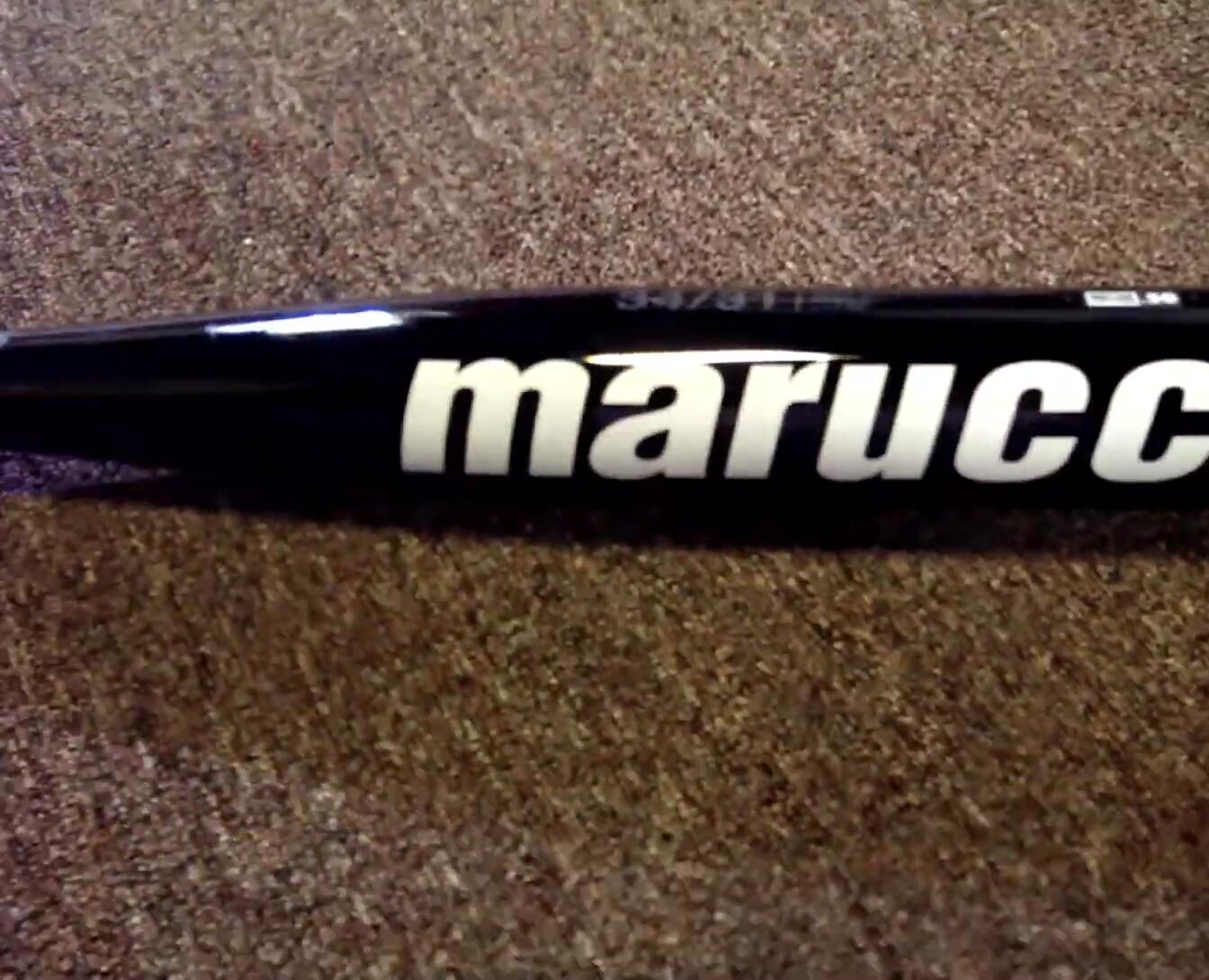 Close-up shot of the bat's end cap highlighting its unique design.