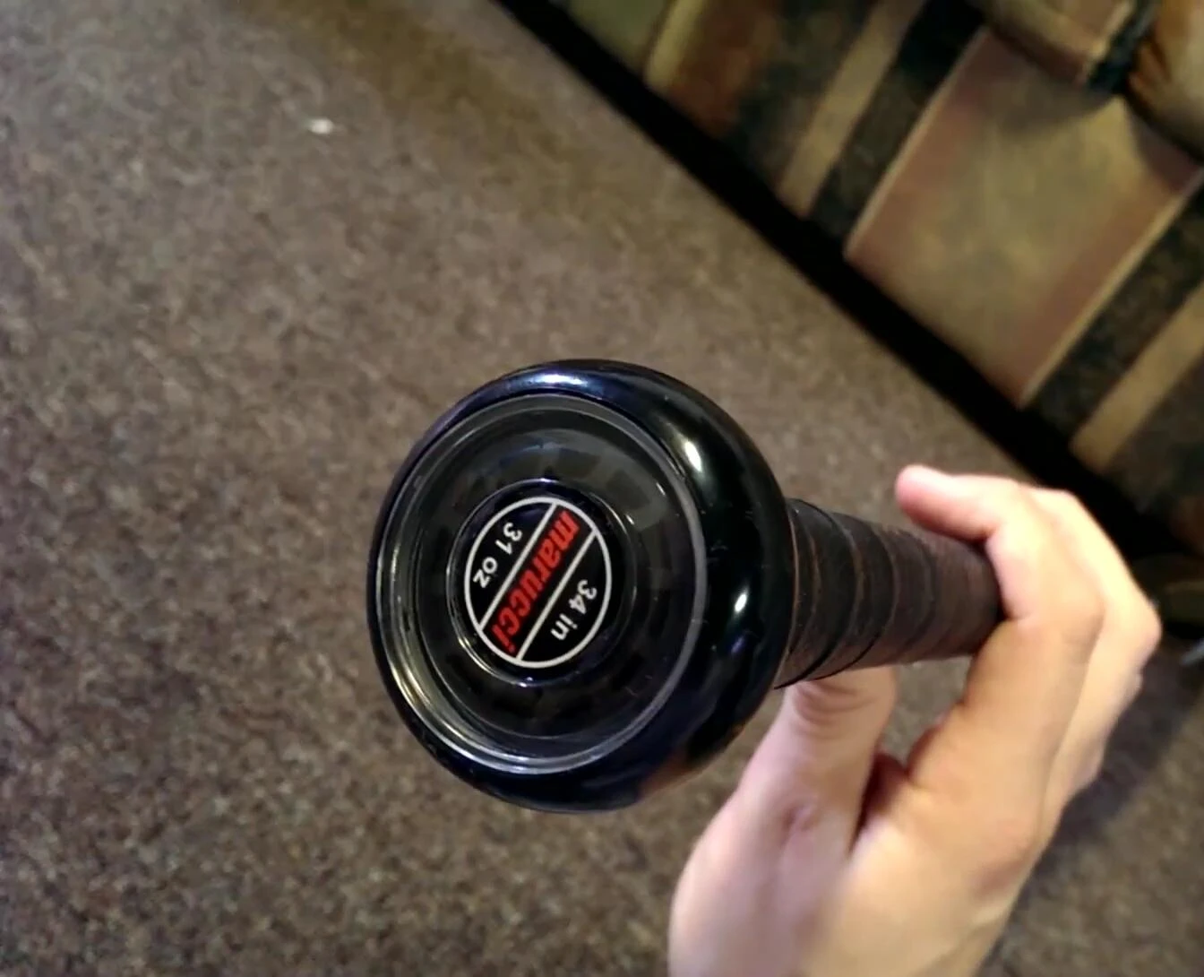 The harmonic dampener in the knob of the bat.