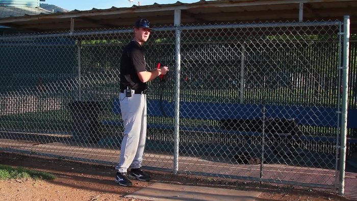 Anchor the resistance band securely to a fence, pole, or sturdy object.