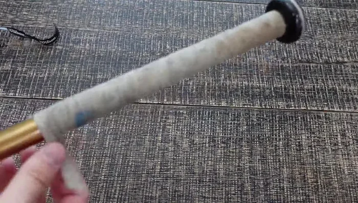 Remove the old grip and tape. It should come off relatively easily, but be prepared for some stickiness.