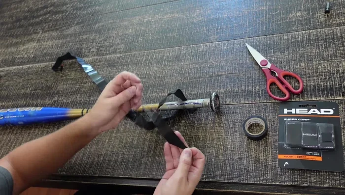 Prepare the new grip. Remove any plastic backing to expose the sticky side.