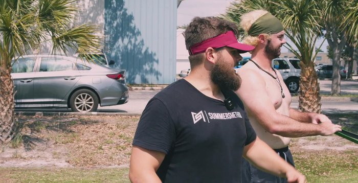 Banded ABCs: Anchor the band as in exercise 6. Perform a pal-off press, then trace the alphabet in the air with large movements.