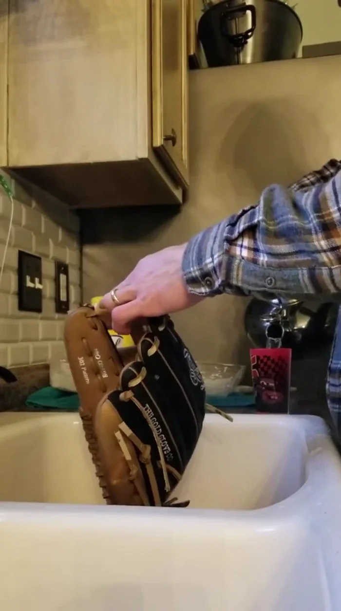 Apply less hot water to the outside of the glove, focusing on the areas you'll be forming.