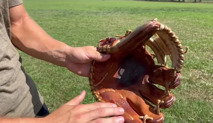 Condition the wrist and exterior. Continue applying conditioner evenly across the wrist and exterior of the glove.