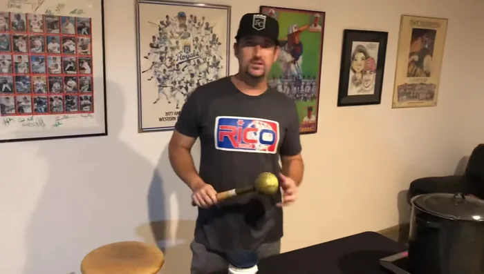 Remove the glove and use a mallet to work the leather, focusing on crease points. Avoid the embroidery.