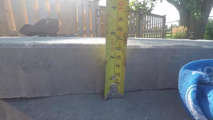 Calculate total excavation depth: base depth + bedding layer + paver height.