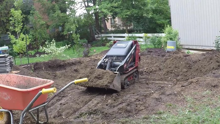Heavier traffic (driveways) requires significantly more excavation than pedestrian traffic (patios/walkways).