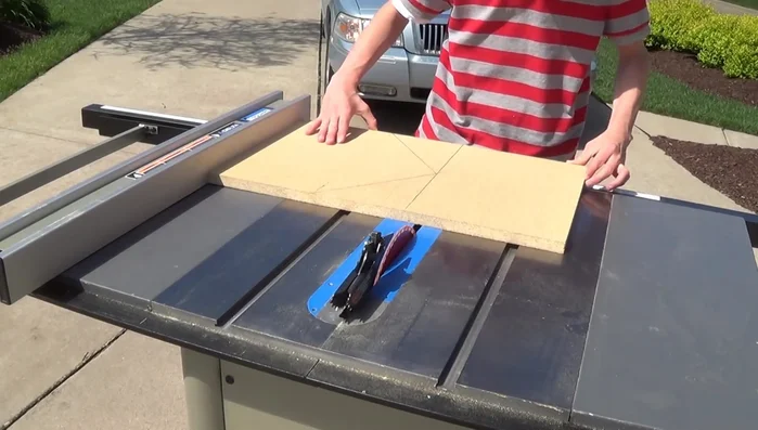 Cut out the home plate shape using a table saw (initial cuts can be done by scoring the material). Use a hand saw for the more intricate cuts.