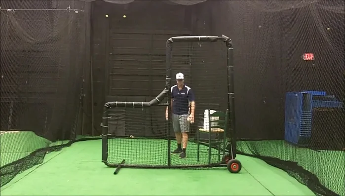 Plant your left foot forward and right foot back, keeping your body to the left of the screen's pole (or to the camera's right).