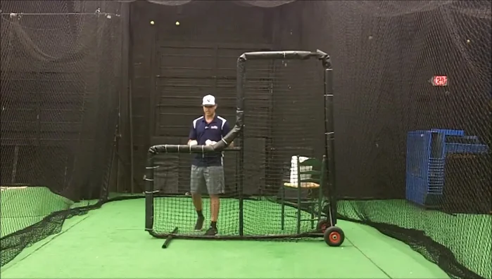 Practice throwing from this position, gradually moving closer to the screen until you find a safe distance where you can still throw effectively.