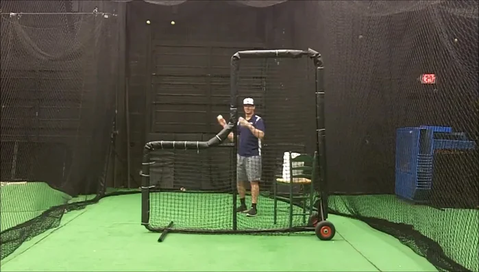 Practice throwing from this position, gradually moving closer to the screen until you find a safe distance where you can still throw effectively.