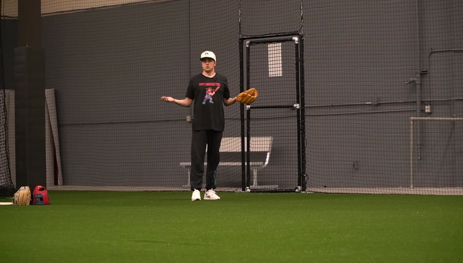 The speaker demonstrating the double hinge break-in method.