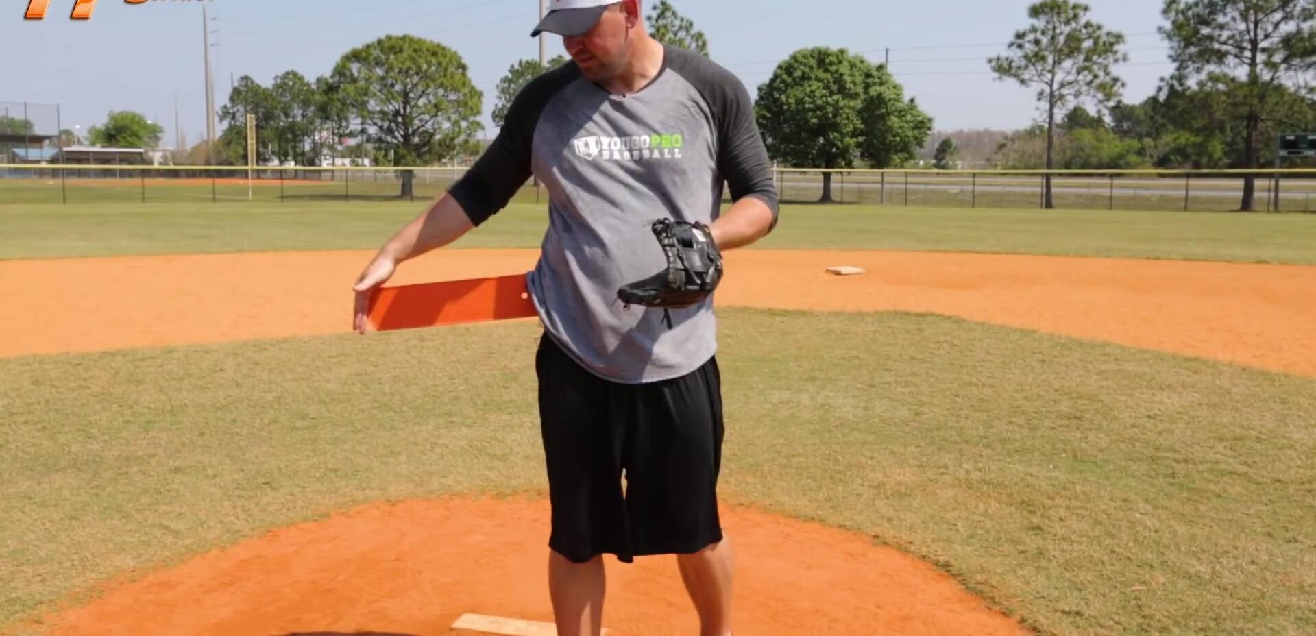 Coach explaining the use of Hip Striker for pitching.