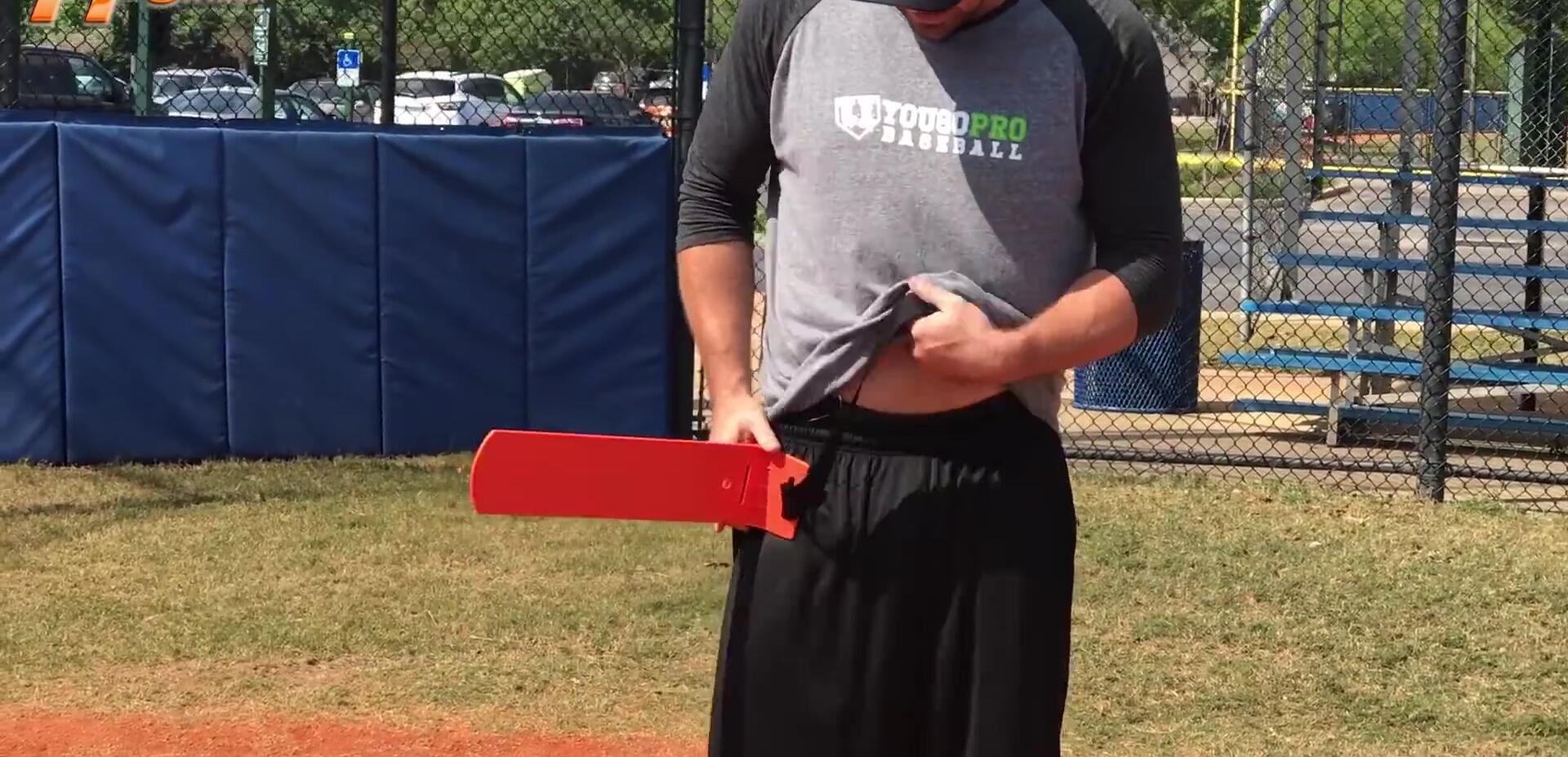 Demonstration of how to strap the Hip Striker around the waist.
