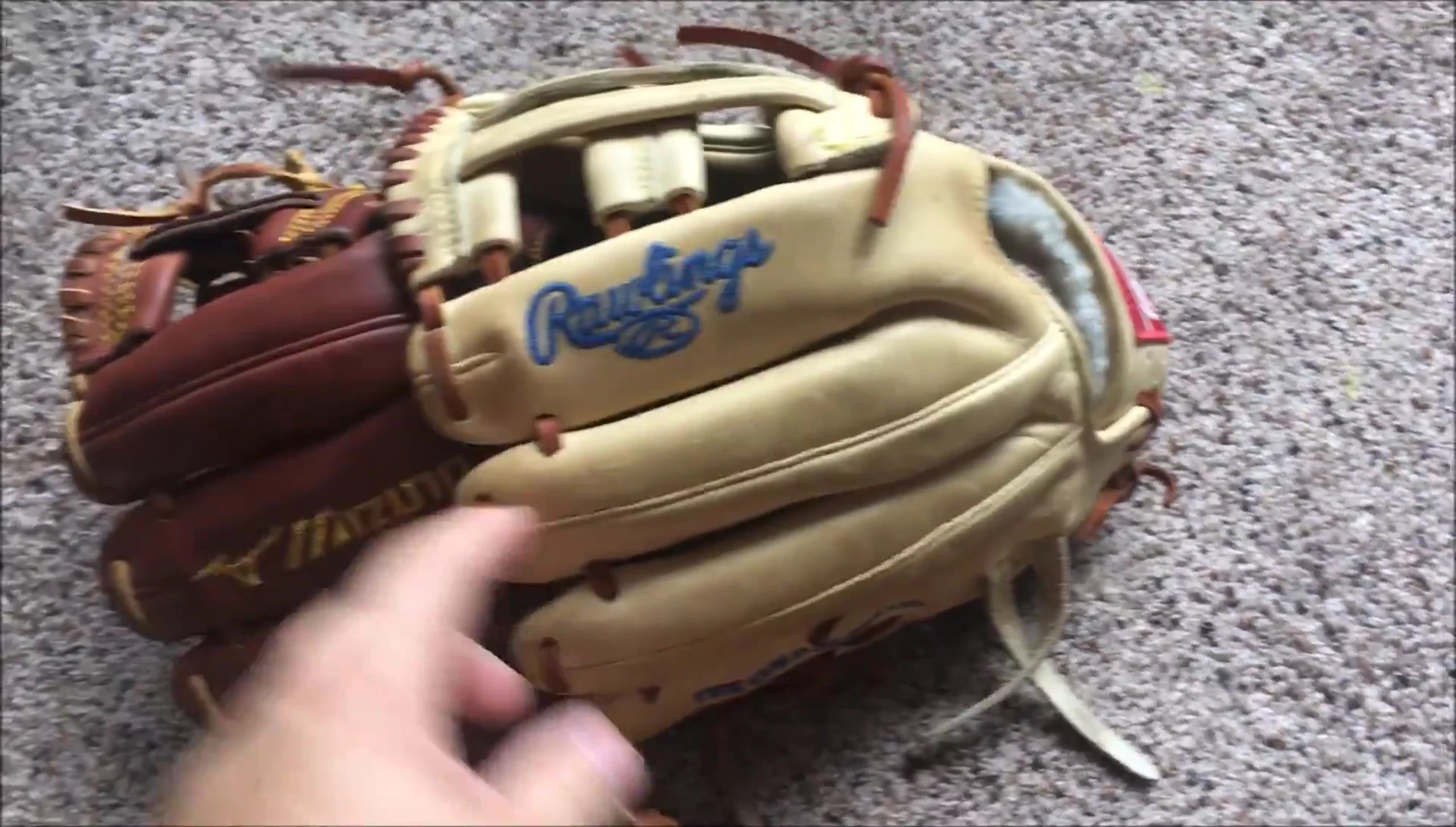 Shot highlighting the single roll belting of both gloves.
